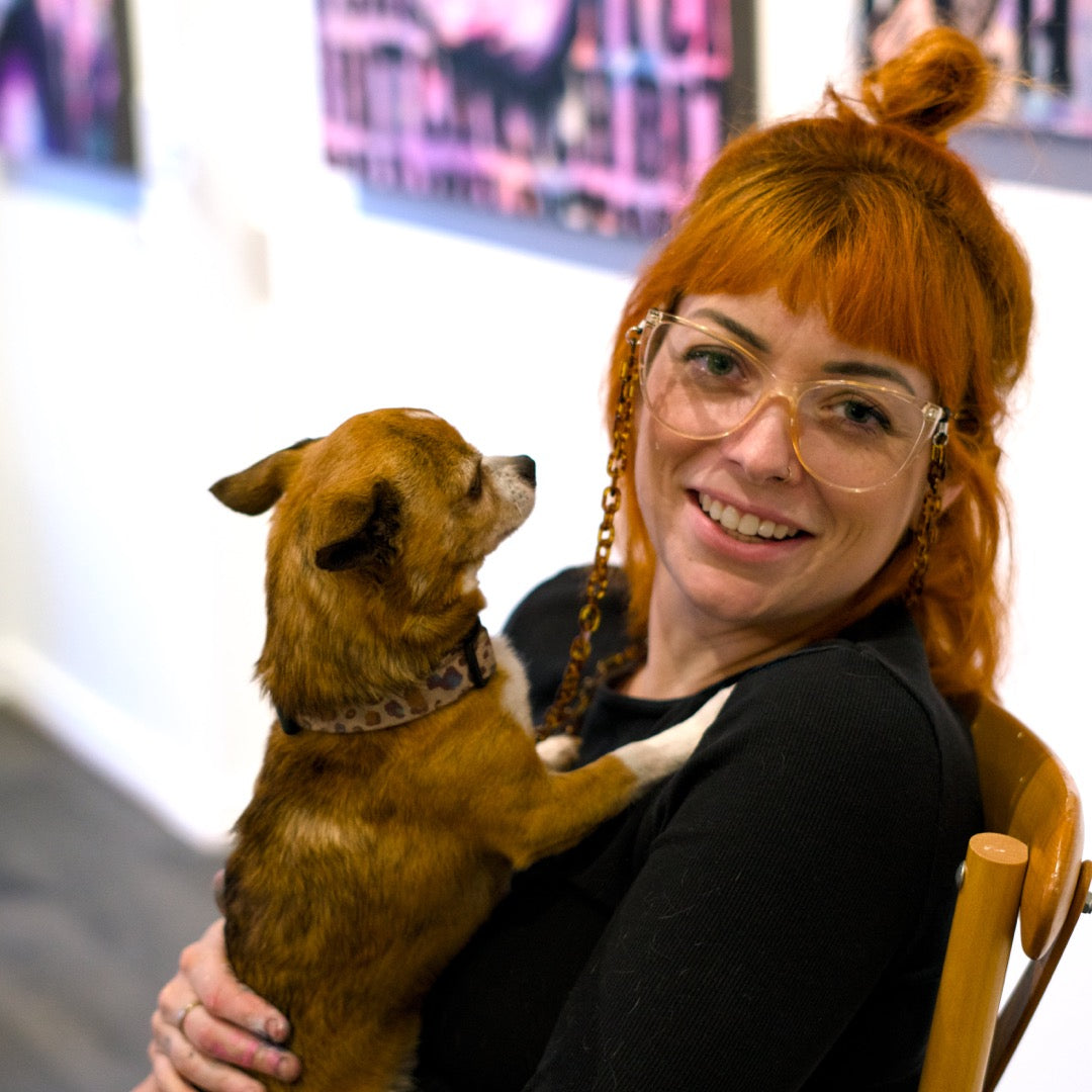 Friendly art classes in Berwick. Woman with red hair holding a small brown dog