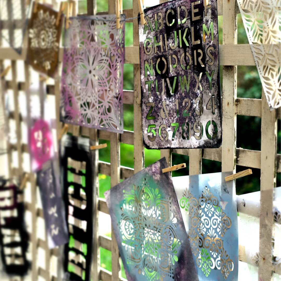 Painting Classes Berwick, Narre Warren, Hallam, Officer, Clyde North. Art Classes Criss Chaney. Collection of decorative stencils with letters and numbers on a wooden surface.