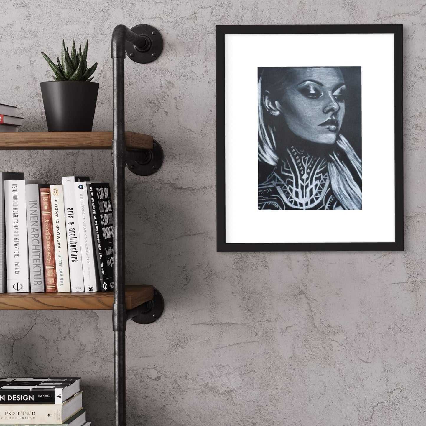 A framed artwork depicting a stylized woman with a neck tattoo, in a black and white color scheme, hung on a wall above a bookshelf.