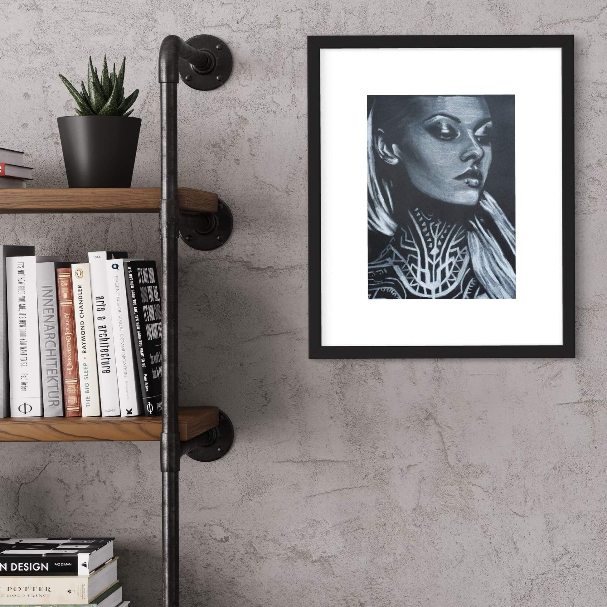 A framed artwork depicting a stylized woman with a neck tattoo, in a black and white color scheme, hung on a wall above a bookshelf.