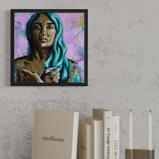 A canvas painting of a woman with a commanding power pose, featuring soft feminine shades of gold, lilac, and teal, with a sleek black frame, displayed on a wall above books.
