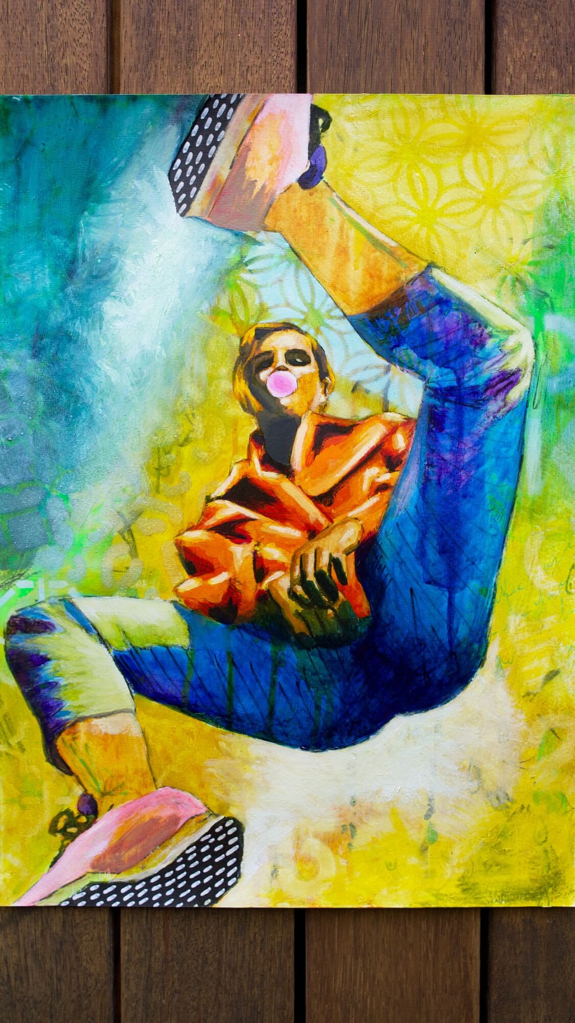 mixed media painting of a woman spinning in air in yellow and blue