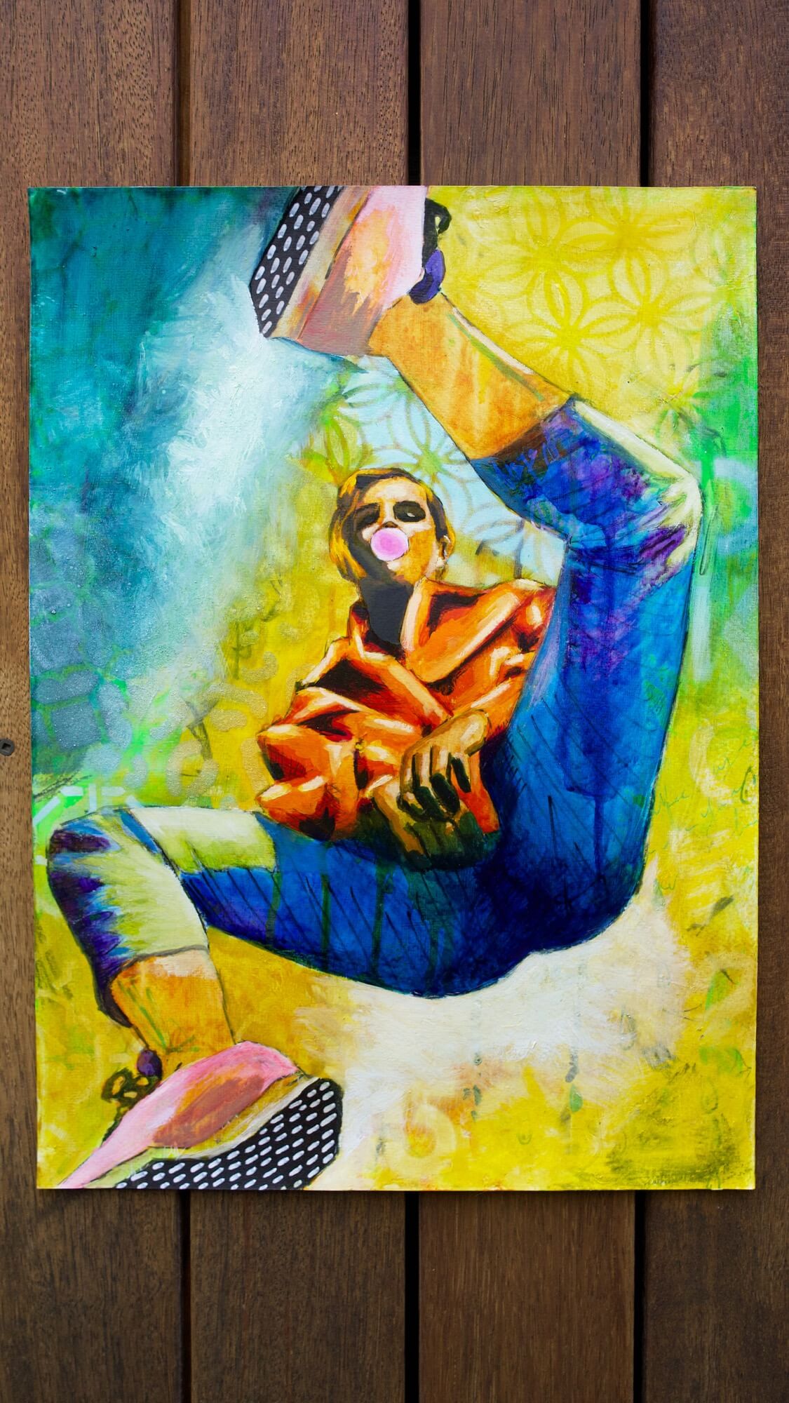 mixed media painting of a woman spinning in air in yellow and blue