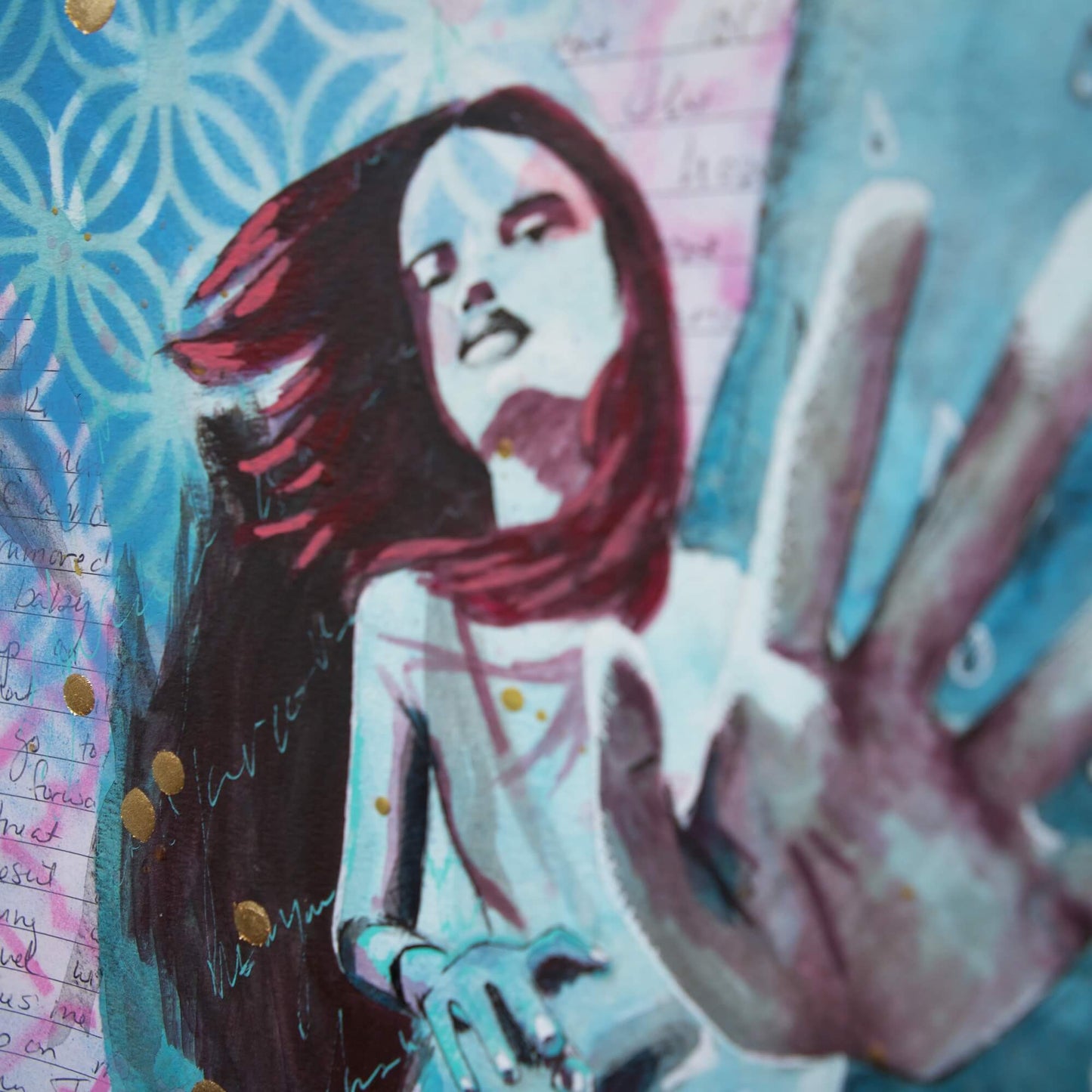 blue painting of a woman reaching out to viewer with gold leaf splatters