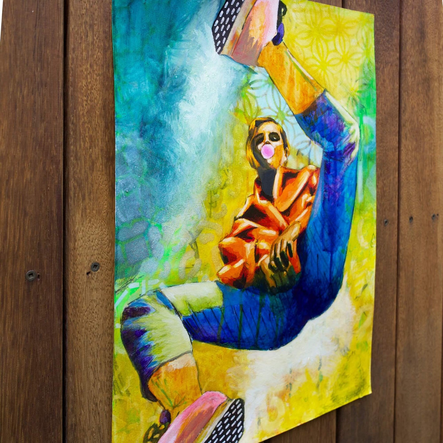 mixed media painting of a woman spinning in air in yellow and blue