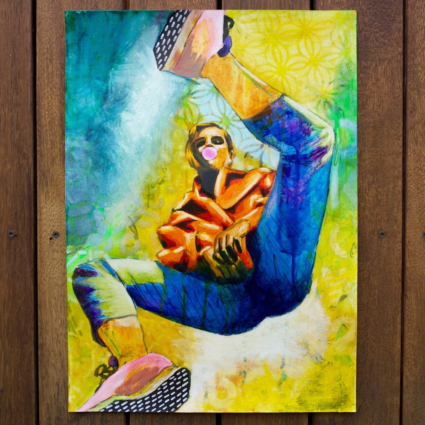 mixed media painting of a woman spinning in air in yellow and blue