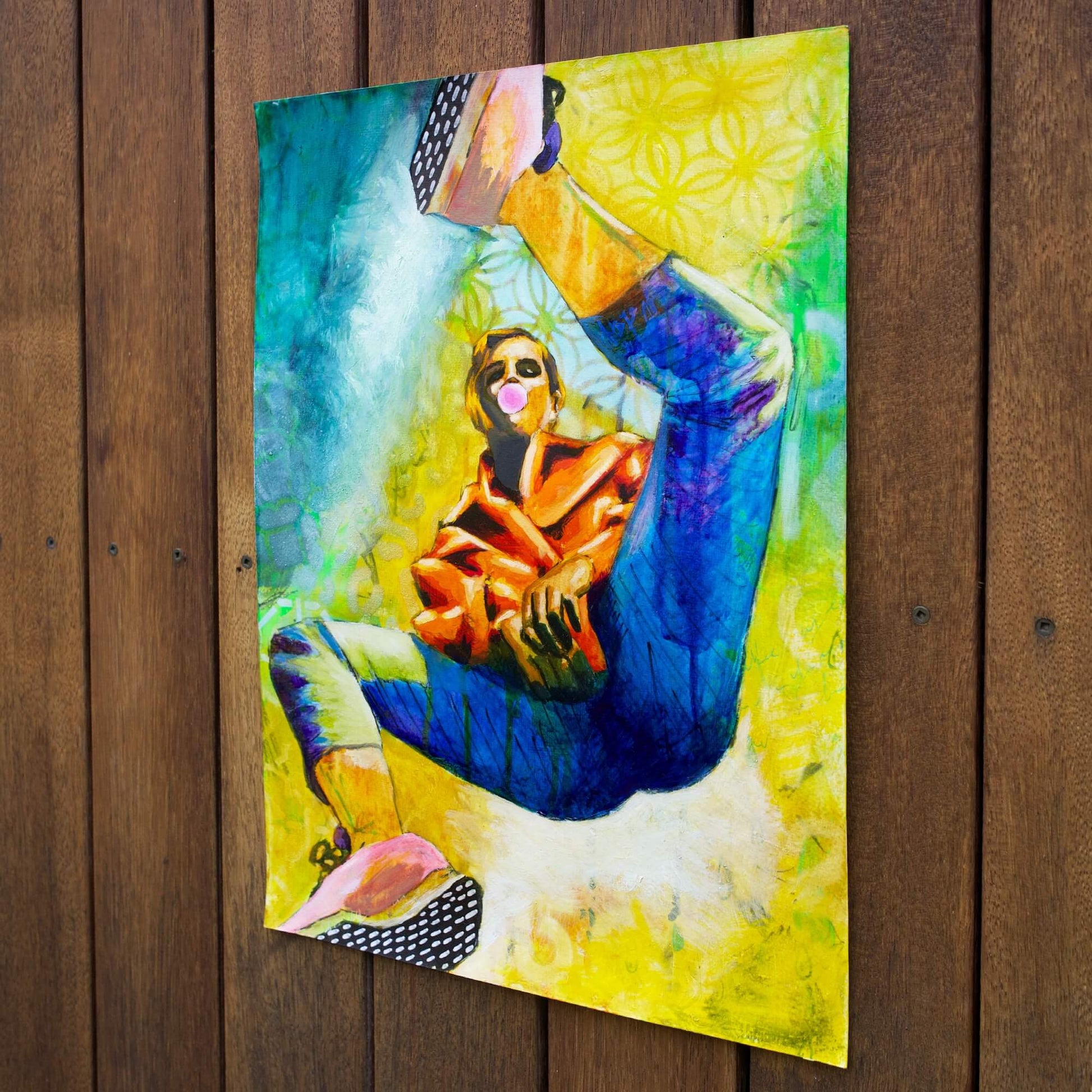 mixed media painting of a woman spinning in air in yellow and blue